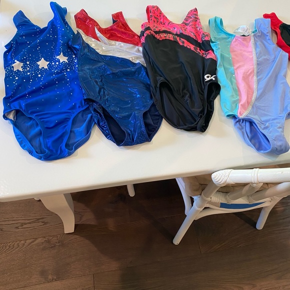 4 varied Girls gymnastics leotards. Sizes CL, 8/10, medium. Hardly worn. - Picture 1 of 2